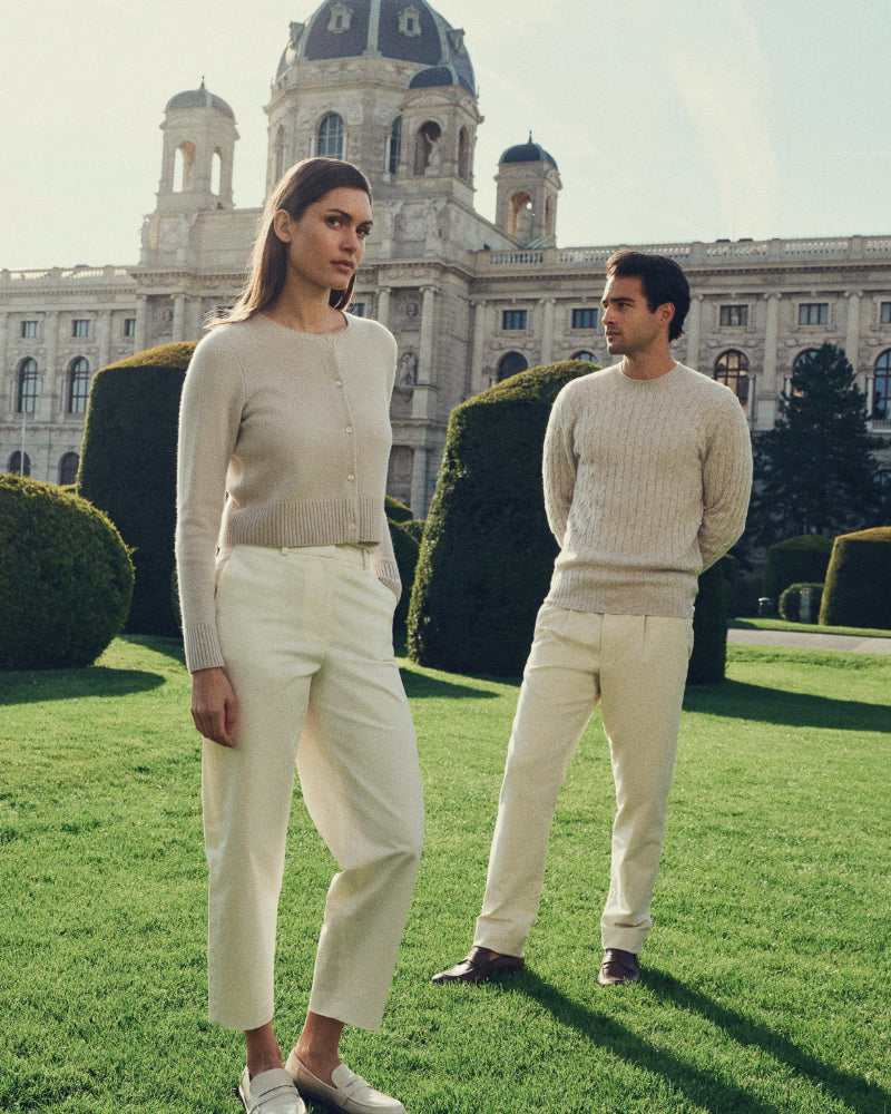 Female and male model wearing N.Peal cashmere in the green spaces of Vienna