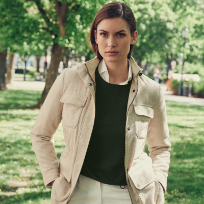 Women wearing a beige jacket in a park setting